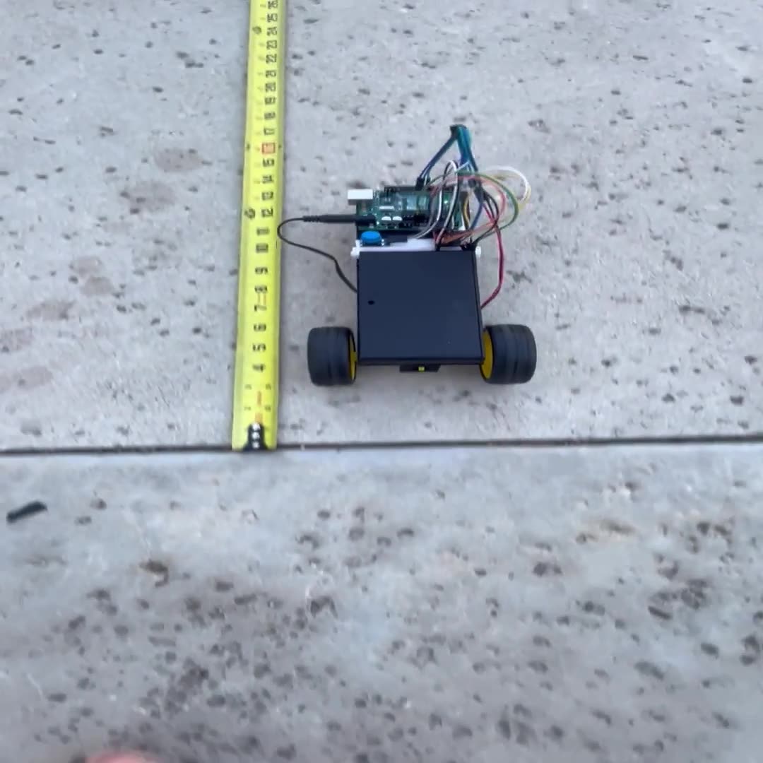 Video still of the first electric vehicle build driving on a desk.