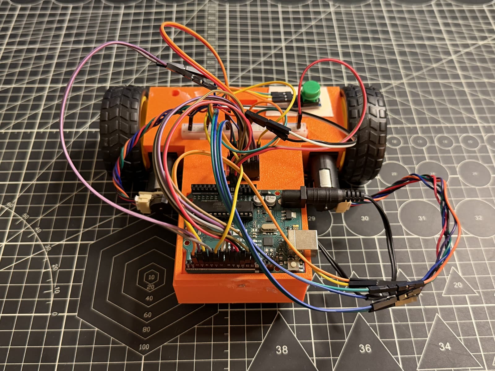 Close detail of the wiring, ATmega chip, and breadboard on the chassis.