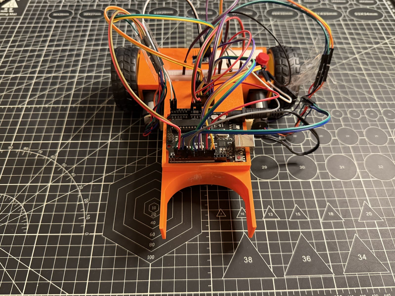 Front-on view of the robot showing the U-shaped printed guide.